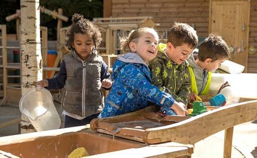Young children playing outside