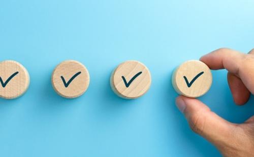 Four wooden pins with ticks